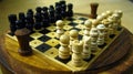 Closeup of a wooden Chessboard. Chess is a two-player strategy board game played on a checkered board with 64 squares arranged in Royalty Free Stock Photo